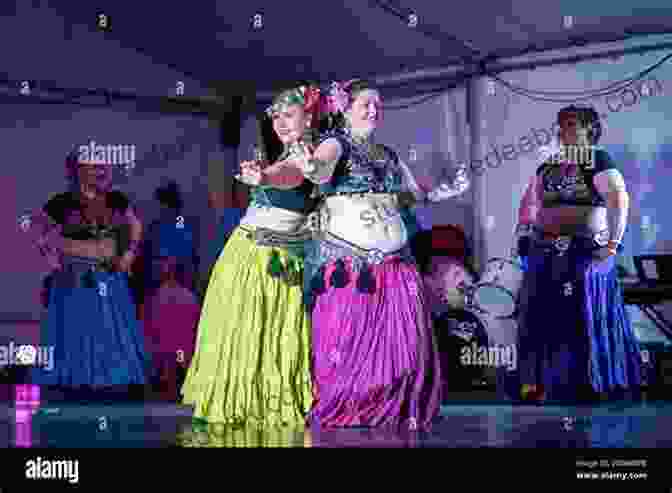 A Belly Dancer Performing On Stage With Colorful Costume And Vibrant Movements THE EXPERIENCE OF THEATER DANCE FOR *Belly Dancers*