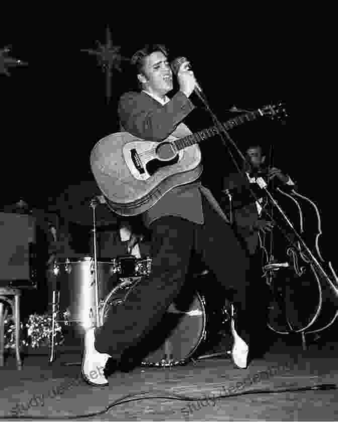 Elvis Presley Standing In Front Of A Microphone Singing If I Can Dream 25 Best Songs Of Elvis Presley
